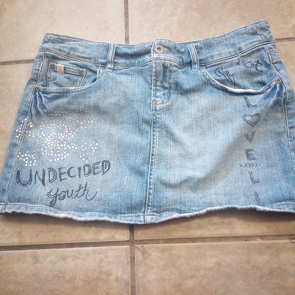 Stylish Blue Denim Mini Skirt with Graphic Accents